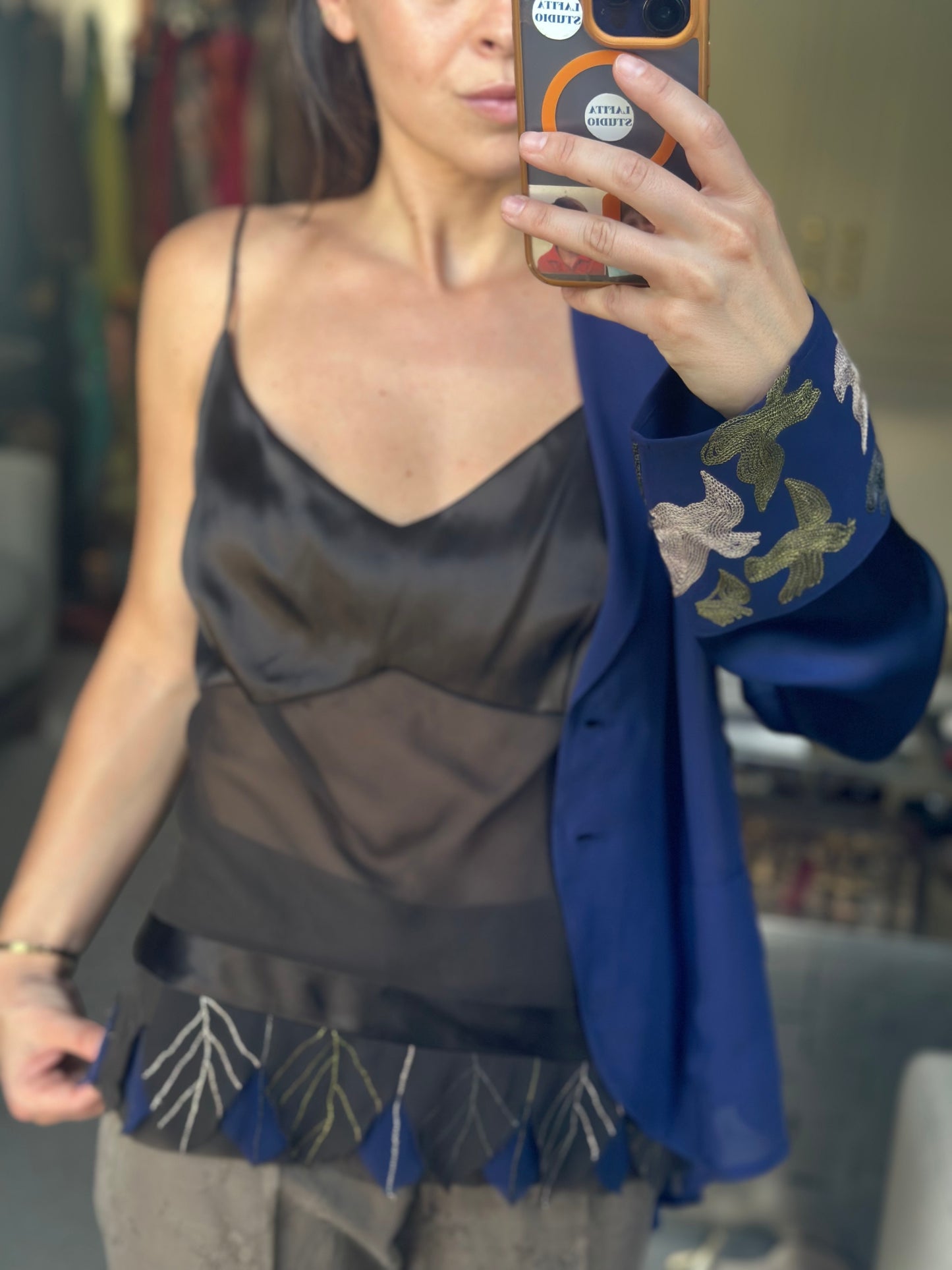 Top plumas con blusa seda